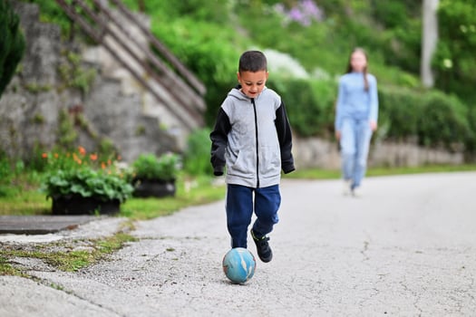 Children playing together in a park or engaging in a game. photo