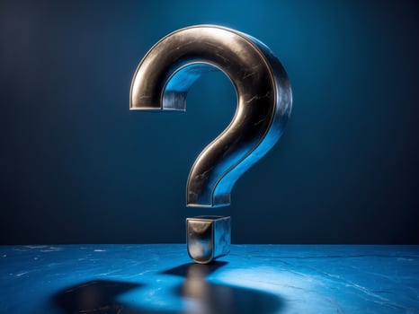 Metallic large question mark on blue textured surface with dramatic lighting and shadows. photo