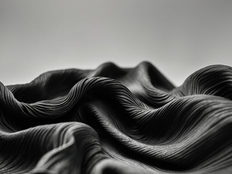 black fabric with ripples and folds wavy surface wallpaper. photo