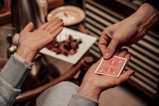 Magician show card trick, man nice play casino gambling, close up hands holding deck photo