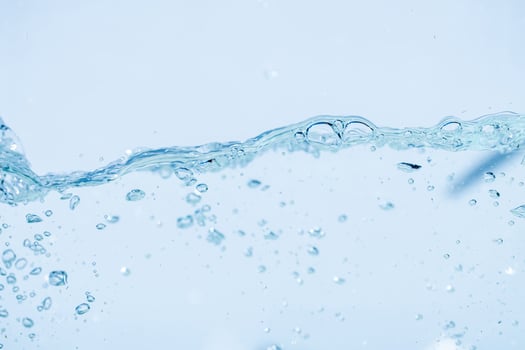 Water splash isolated on white background, Air Bubbles Float Up Under Blue Water. Pure Water Wave Oxygen Relaxation. Blue bubbles Water Textured. photo