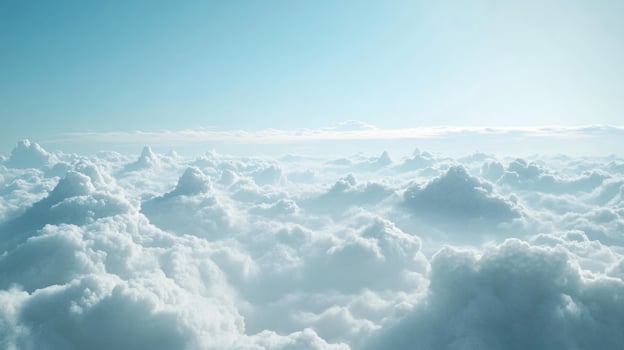 Aerial view of beautiful white cloudscape covering the earth on a clear sunny day photo