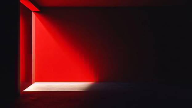 Light beam from a doorway illuminating a red wall in a dark room photo