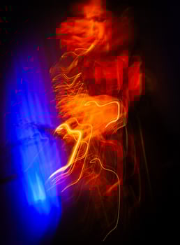 Saxophone Player on Stage. Fiery Light Trails Dance photo