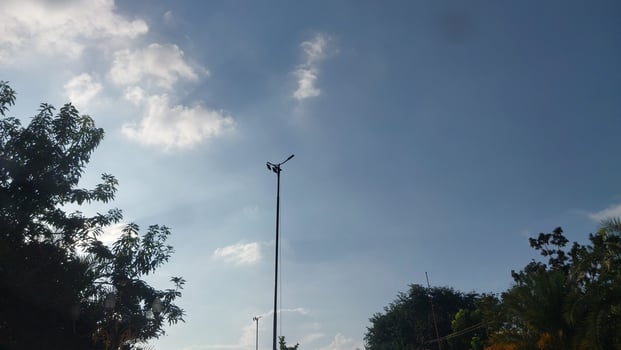Silhouetted Lamp Post Against a Vibrant Sky photo