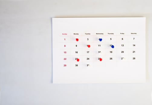 calendar on wall with pin on it photo