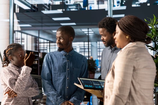 Black enterprise professionals collaborate on business strategy, emphasizing problem solving and corporate growth. Staff leveraging data analytics to meet key organizational objectives. photo