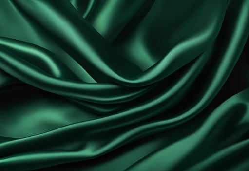 Dark green silk satin background featuring elegant soft folds on a smooth fabric surface perfect for luxurious wide design banners. photo