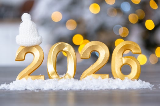 Golden figures number 2026 New Year background of fairy light, snow and garlands. Greeting card, Happy New Year, cozy home photo