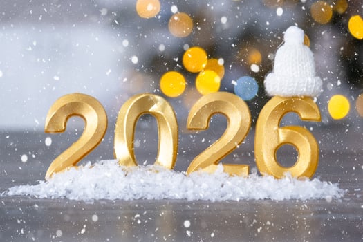 Golden figures number 2026 New Year against the background of fairy light, snow and garlands. Greeting card, Happy New Year, cozy home photo
