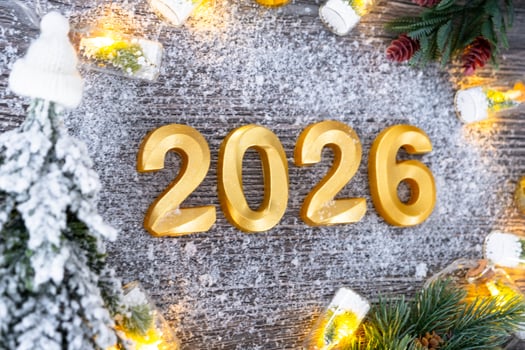 Happy New Year golden numbers 2026 on grey background with Christmas tree, snow, lights of garlands. Greetings, postcard. Calendar, cover photo