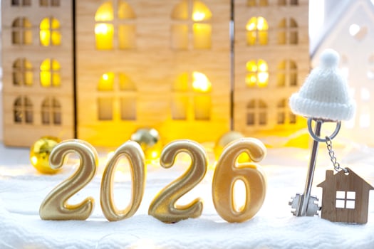 Golden figures number 2026 and tiny home of cozy windows of a house with warm light with festive decor of stars,snow and garlands. Greeting card, Happy New Year, cozy home photo