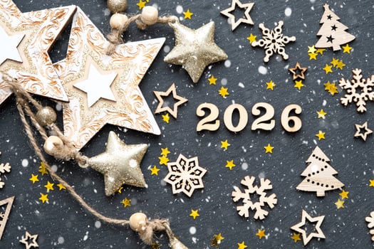 Happy New Year-wooden letters and numbers 2026 festive black background with sequins, stars, snow. Greetings, postcard. Calendar, cover photo