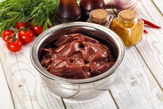 A metal container filled with meat and spices photo