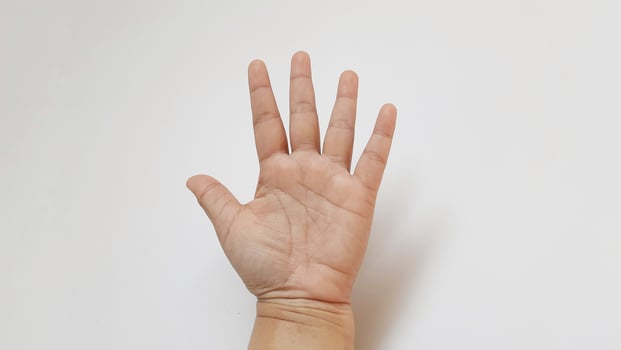 Human hand showing give me five for something photo