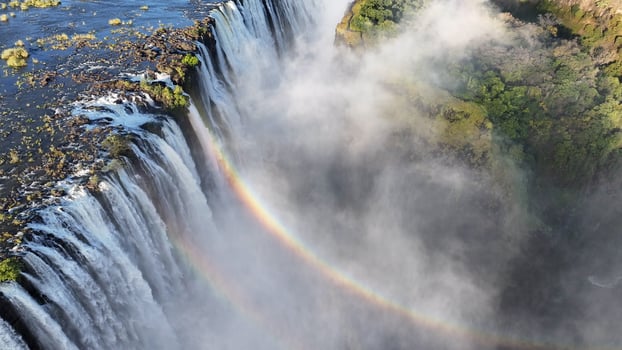Above view of Rainbow in Waterfall at Victoria Falls Matabeleland North Zimbabwe . Travel Scene. photo