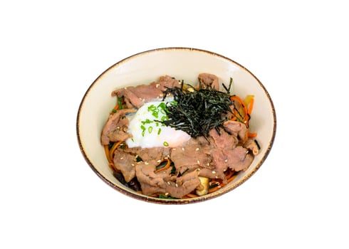 Donburi wagyu beef slices with onsen egg, rice, vegetables in bowl on white background photo
