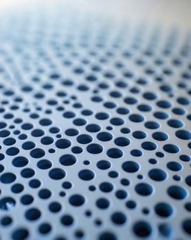 Blue Perforated Metal Surface Close Up View photo