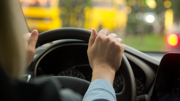 Caucasian girl woman hands female driving rental car driver traveling transport in city automobile road trip businesswoman touching steering wheel roadway auto unrecognizable lady travel vehicle owner photo