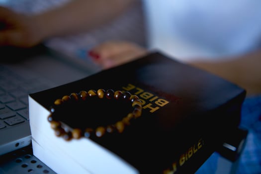 a senior woman attends online church, conference with priest sty photo