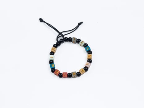 Colorful bracelet made of unique beads, with adjustable string for a perfect fit. Perfect for gift or personal use. photo