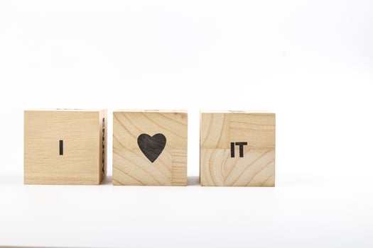 Wooden cubes with the inscription I Love It on a white background photo