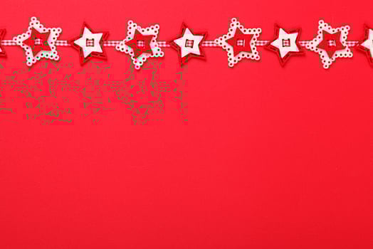 close up Christmas garland on a red background photo