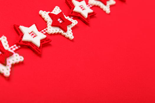 Christmas garland on a red background close up photo