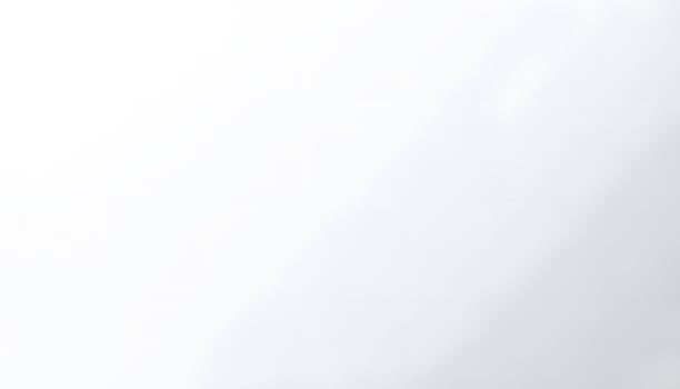 A man is standing in front of a white wall photo