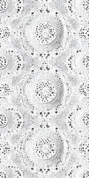 Intricate white lace pattern showcasing delicate floral designs and textures photo