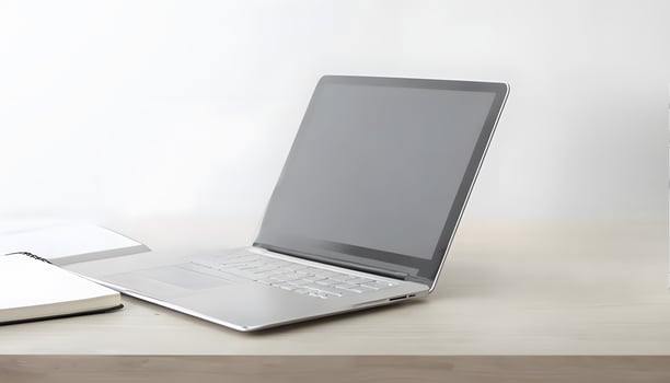 Laptop with blank screen on wooden desk photo