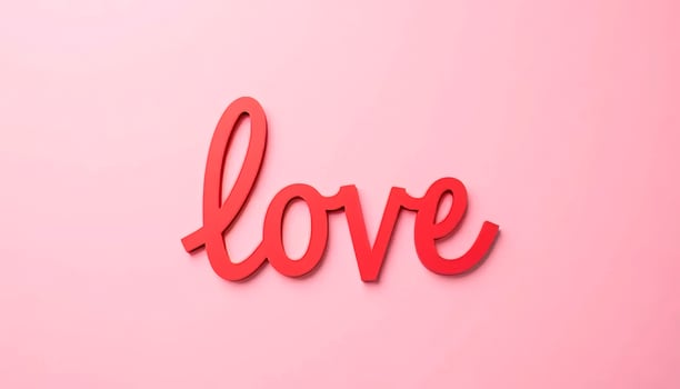 Lettering word love made out of paper letters on pink background with space for text, valentine and mother day, birthday photo