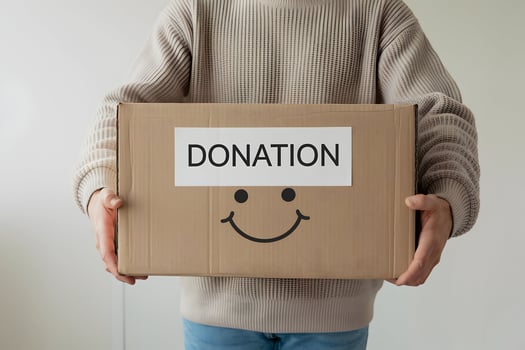 Cheerful face on donation box emphasizes giving with a clean background photo