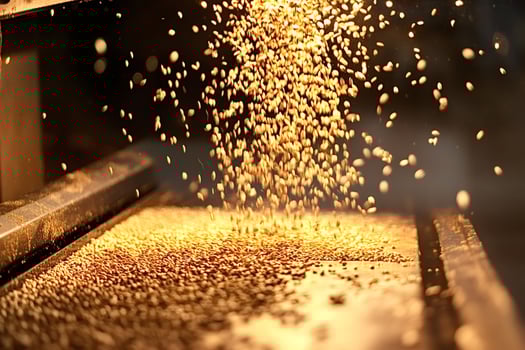 Industrial machine processing golden grains of wheat photo