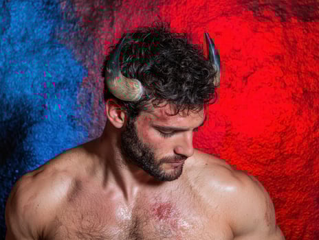 Man with horns on head against red and blue background photo
