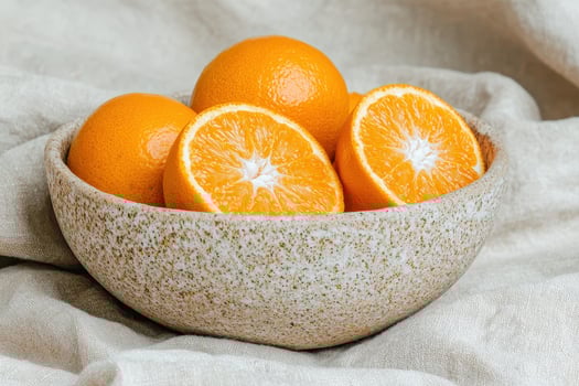 Close up of juicy oranges in a rustic bowl photo