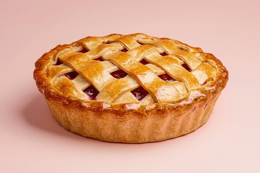 Delicious Homemade Lattice Top Cherry Pie on Pink Background photo