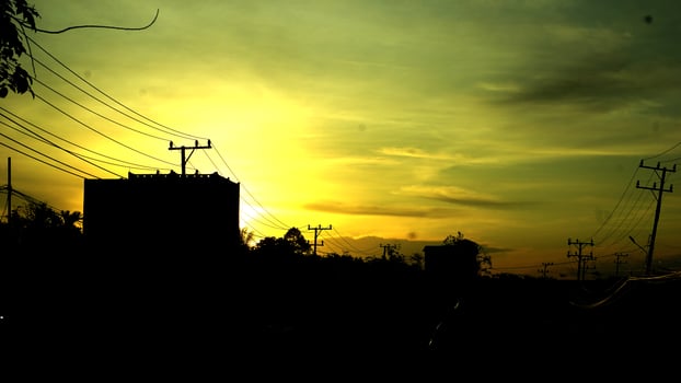 Urban Sunset Silhouette with Power Lines photo