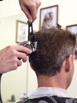 Men's haircut machine. Men's hair with the help of clippers. photo