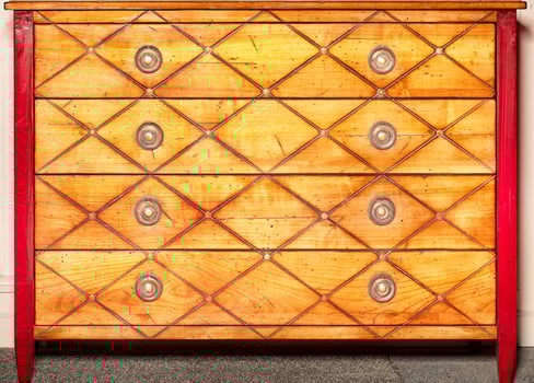 Antique design wooden chest of drawers with drawers and brass handles. photo