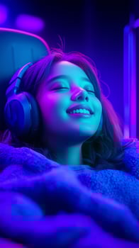 asian young woman smiling while sitting on a gaming chair, wearing headphones on her head photo