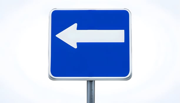 A blue and white road sign with an arrow pointing in the direction of the right photo