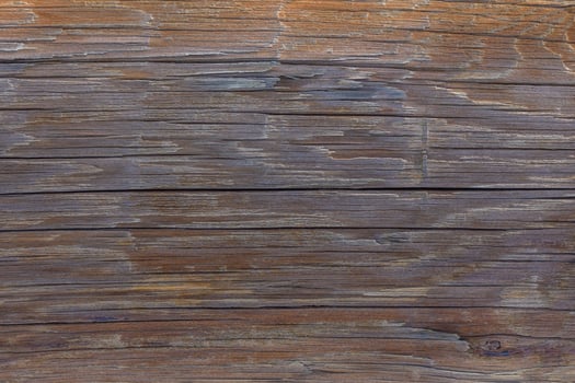 Rustic wooden surface showcasing natural textures and warm hues from a sunlit workshop environment photo
