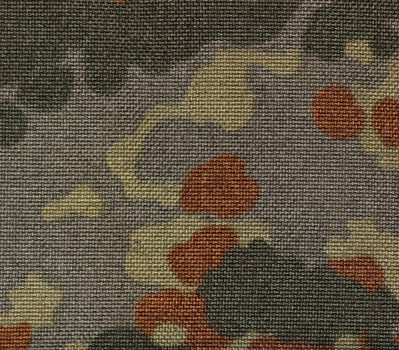 Surface of a military camouflage fabric. photo