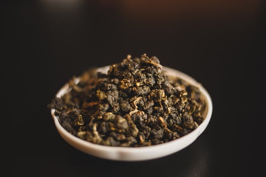 A bowl of green tea sitting on a table photo