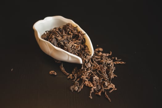 A bowl of dried tea on a table photo