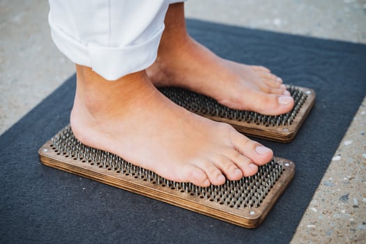 Experience the rejuvenating Foot Reflexology Therapy performed on a specially designed Wooden Massage Board photo