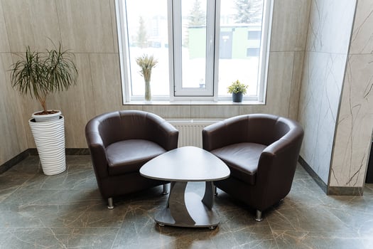 A pair of chairs in a room photo