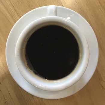 top view of white coffee cup photo