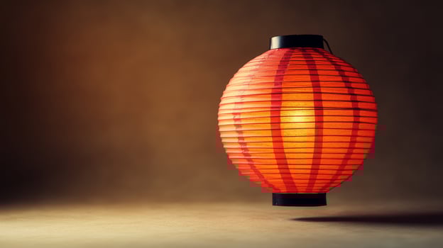 A red paper lantern on a table photo
